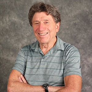 Richard Appelbaum smiling with arms folded.