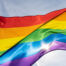 rainbow-flag-lgbt-movement-sunny-blue-sky-background-colorful-gay-flag-waving copy