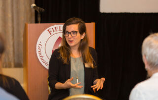 Dr. Lauren Mizock speaks to a group of people at a Fielding Graduate University Event.